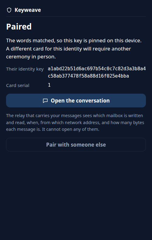 A dark phone-sized screen headed 'Paired', showing the other party's identity key, a card serial of 1, and an 'Open the conversation' button.
